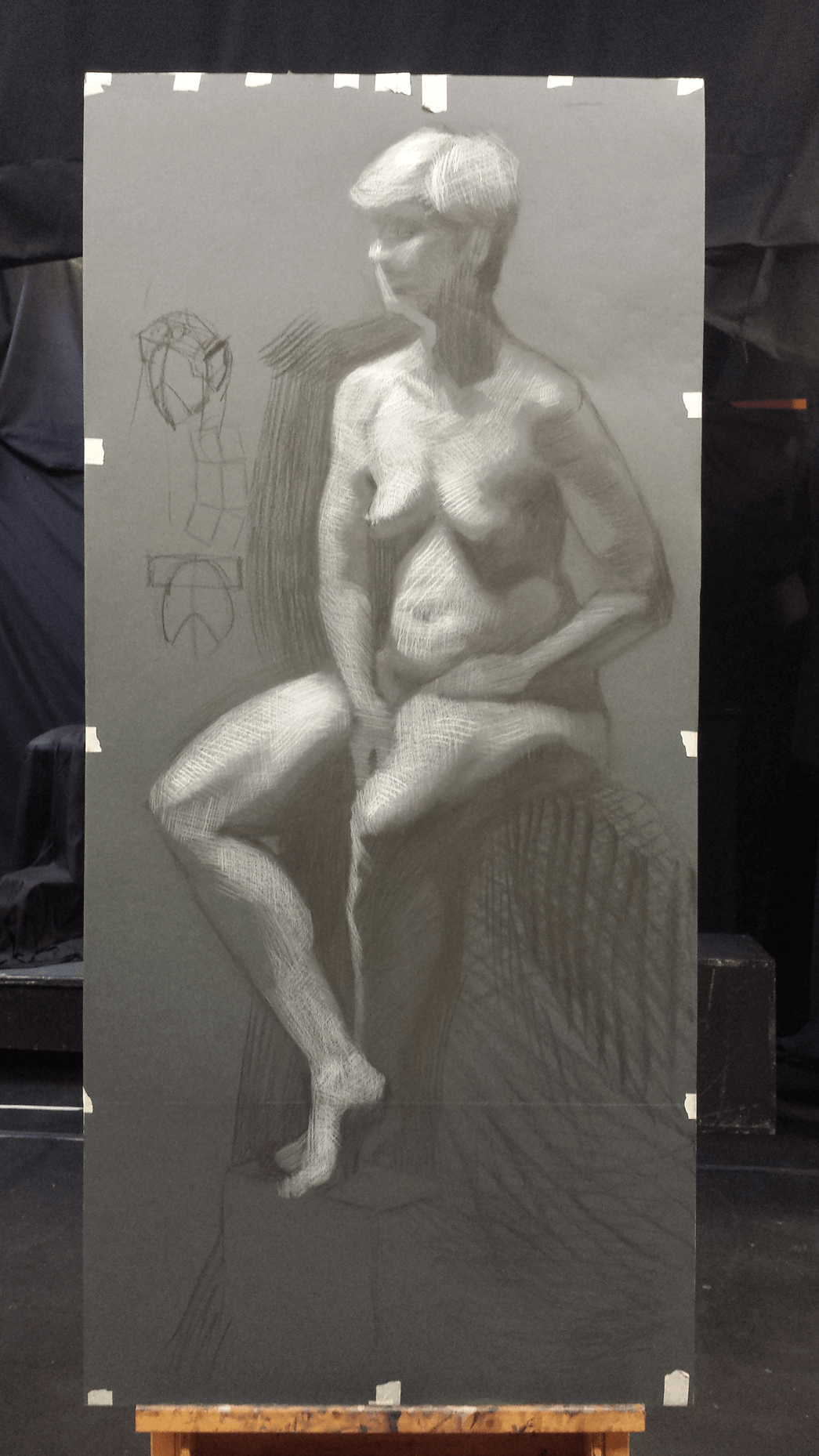 Longpose study in charcoal and white chalk on grey paper.