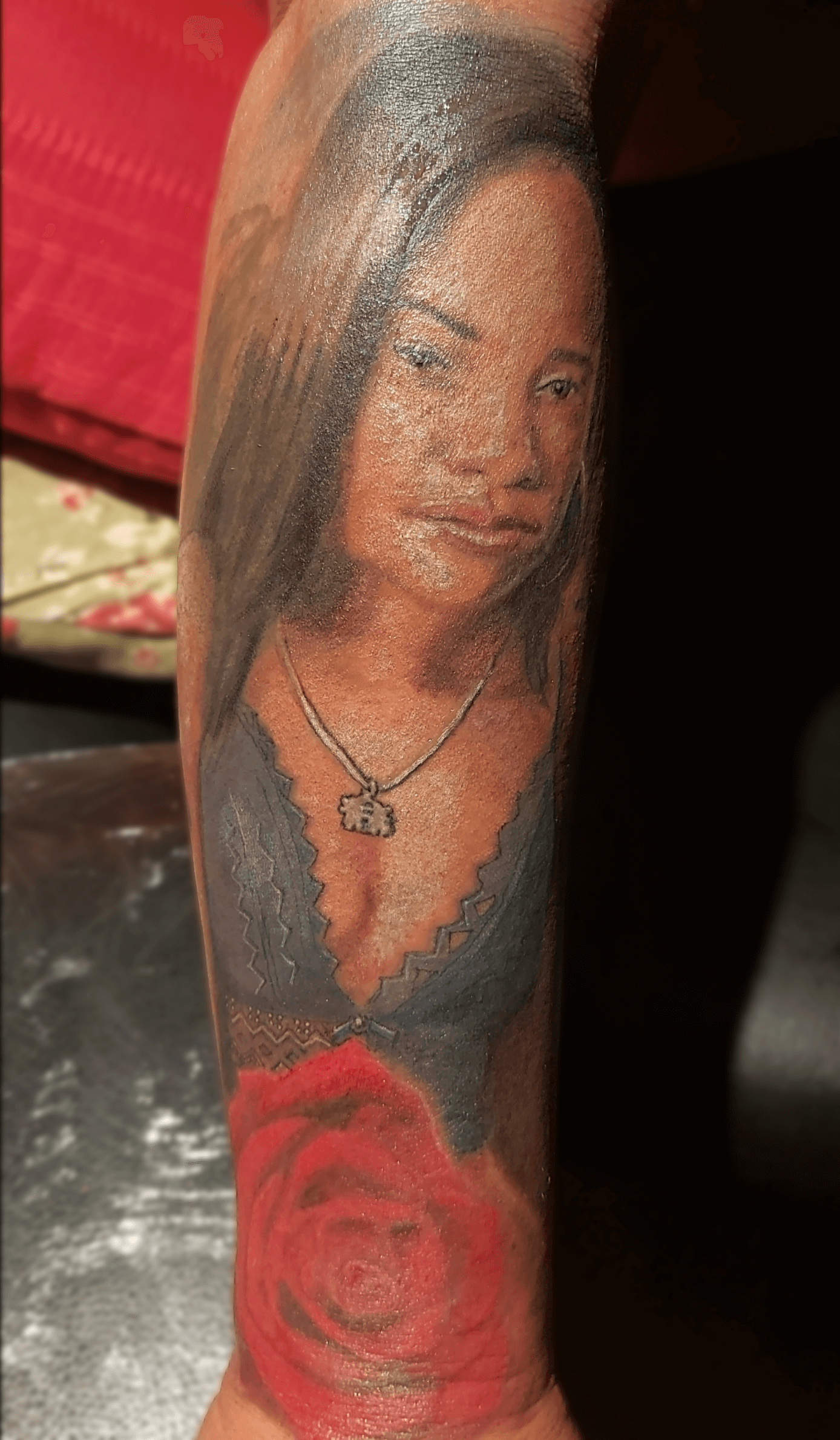 Bottom Half Sleeve Agatha portrait and rose color Tattoo on dark skin fresh in the studio 2023