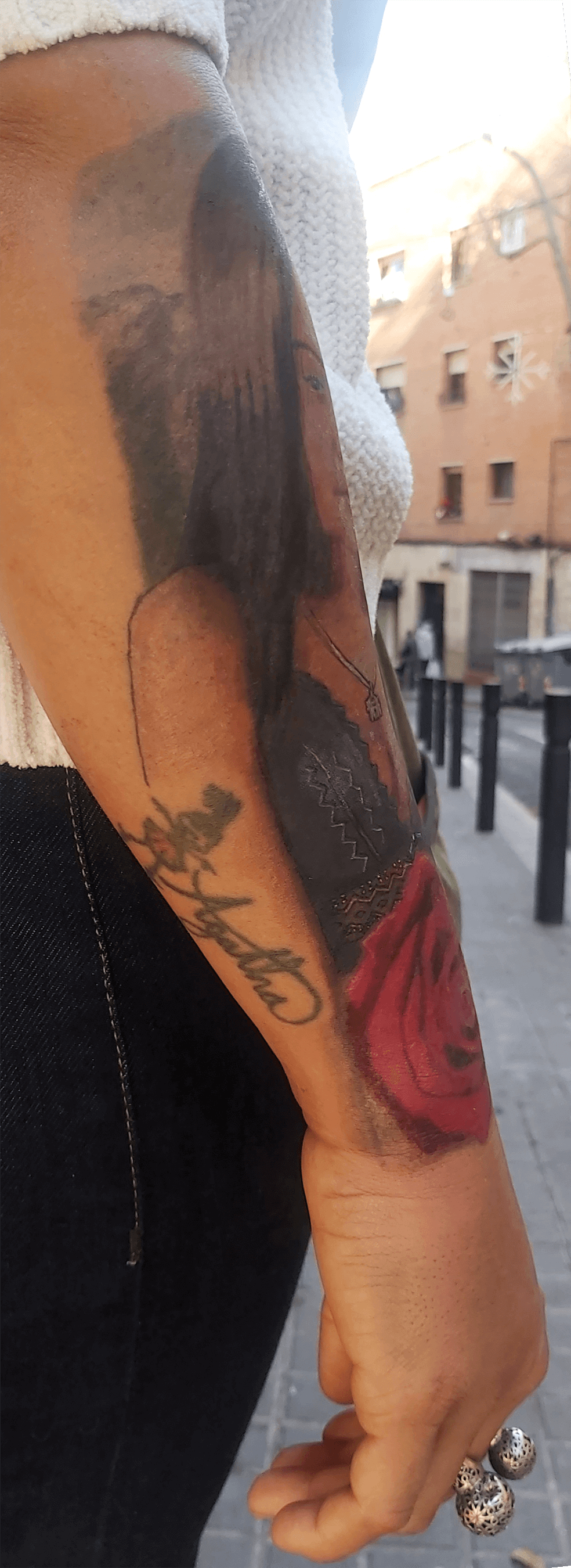 Bottom Half Sleeve Agatha portrait and rose color Tattoo on dark skin outdoor day after